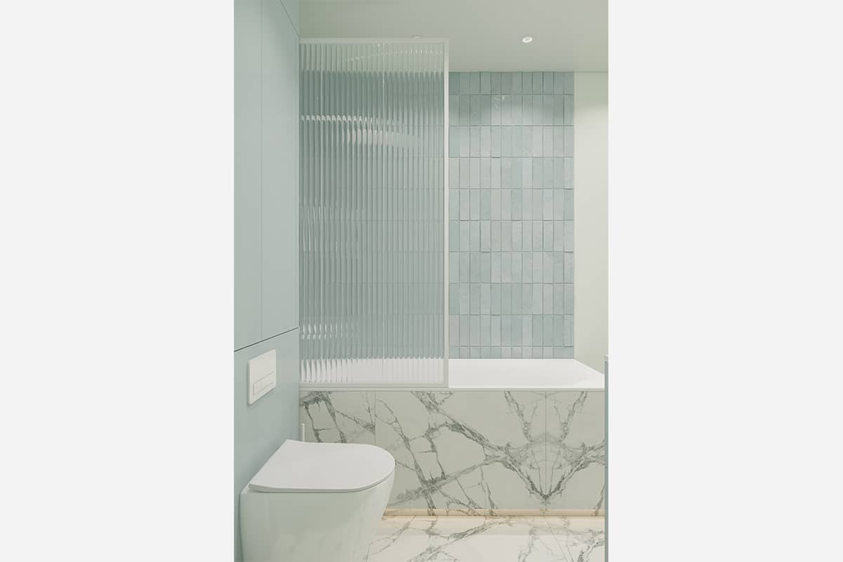 The interior of the blue bathroom with marble and lighting