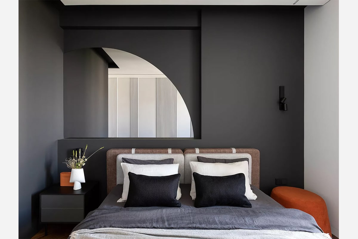 Minimalistic interior of dark bedroom